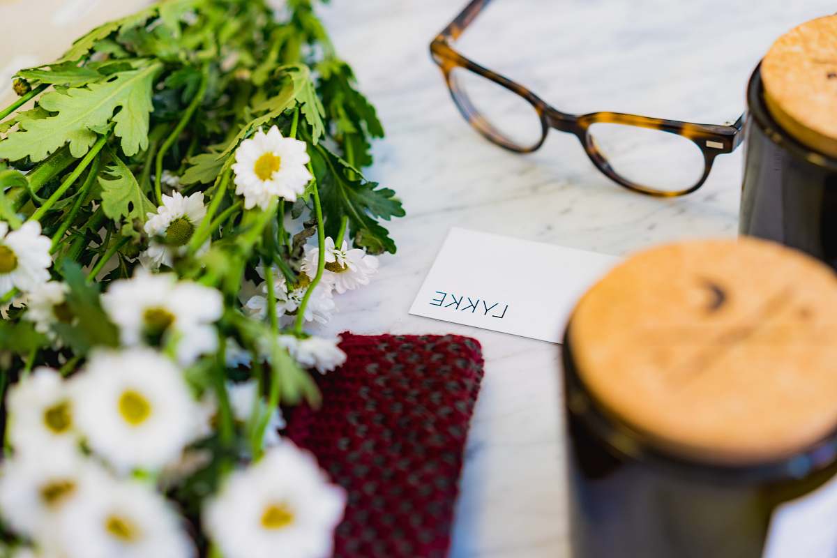 glasses shallow focus photo of eyeglasses beside flower lykke